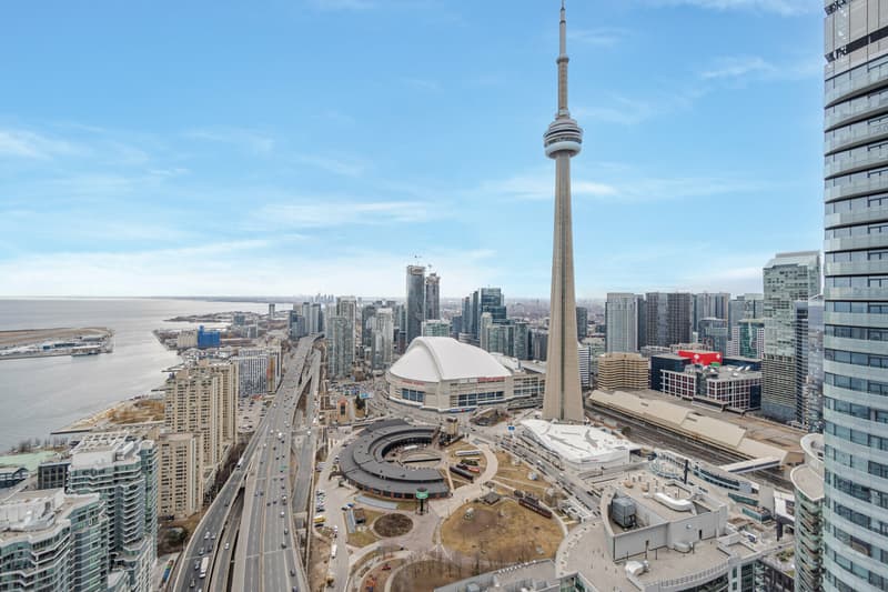 The view from the suite on York Street: the CN Tower and the Rogers Centre, the Gardiner Expressway and the lake beyond